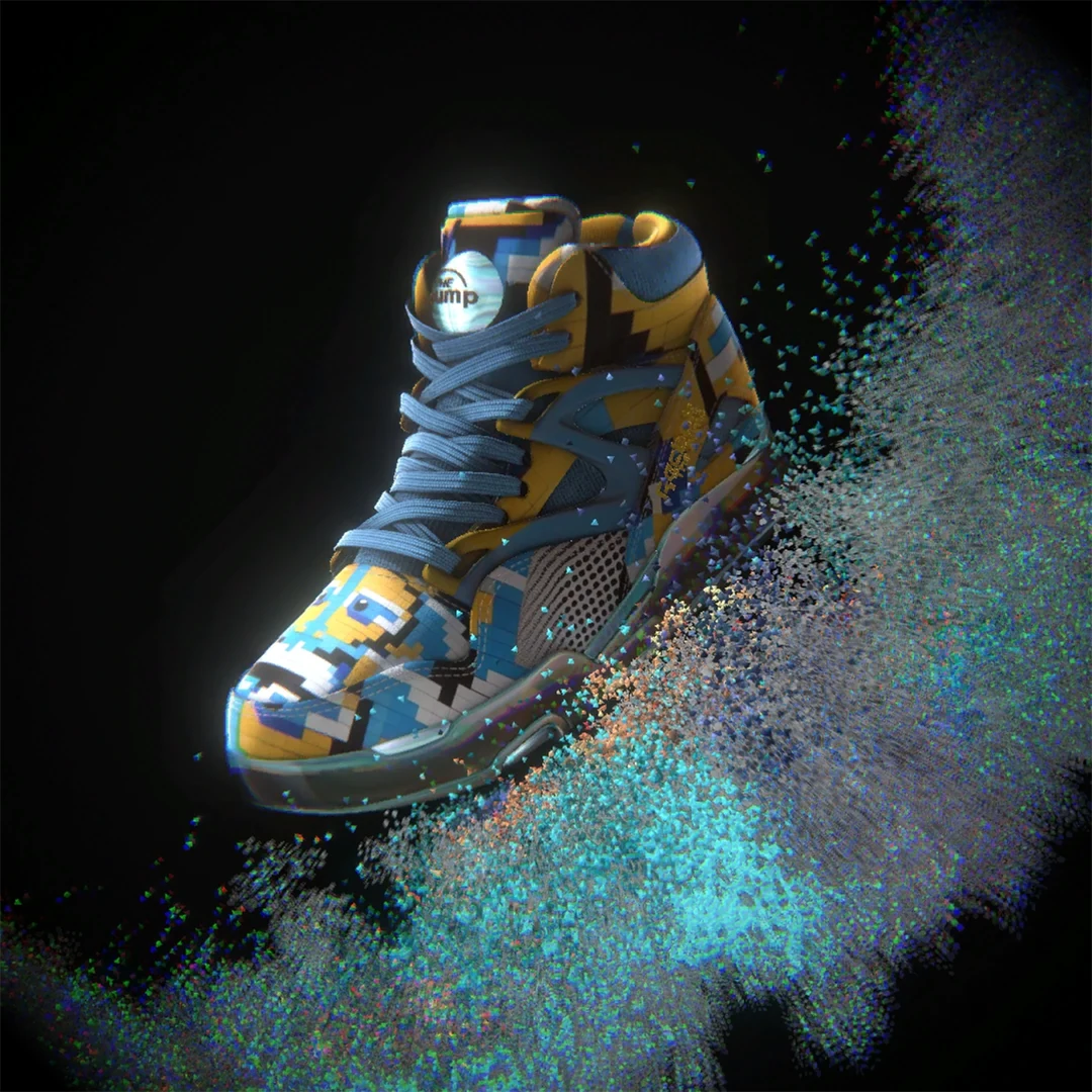 Reebok Pump high-top with a yellow and blue pixel pattern above a sweep of shimmering particles